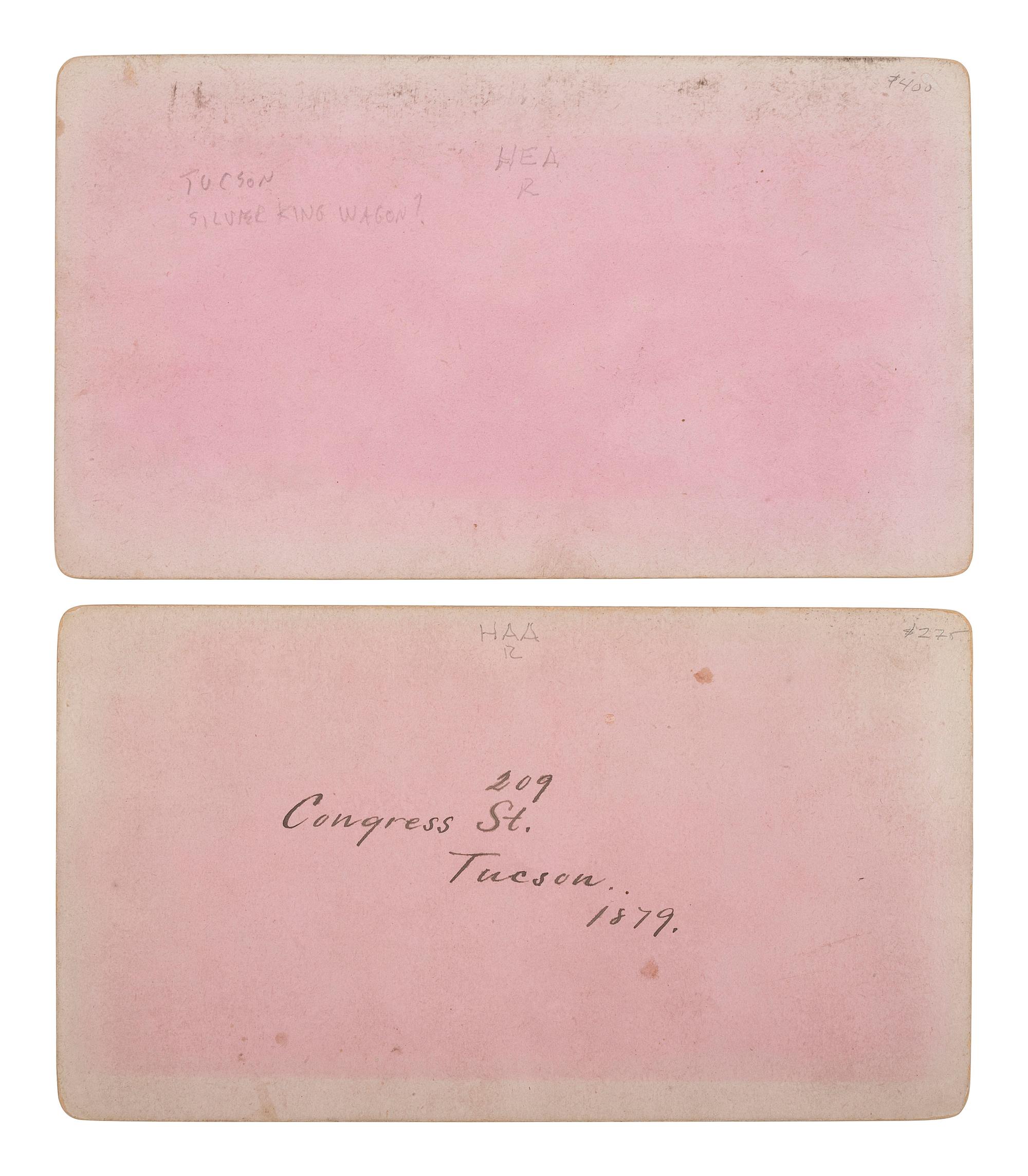 [WESTERN AMERICANA - ARIZONA]. BUEHMAN, Henry (1851-1912), photographer. A group of 2 stereoviews of Tucson, incl. view of Congress Street and horse-drawn ore cart passing through town. Tucson, Arizona Territory, ca 1870s.