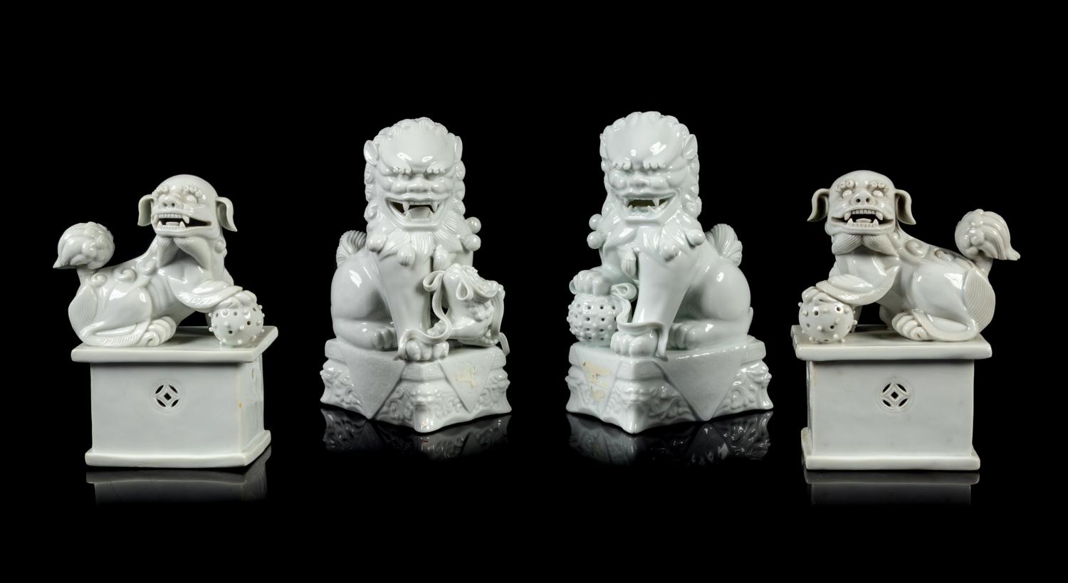 Two Pairs of Chinese Blanc-de-Chine Porcelain Figures of Fu Lions