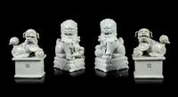 Two Pairs of Chinese Blanc-de-Chine Porcelain Figures of Fu Lions