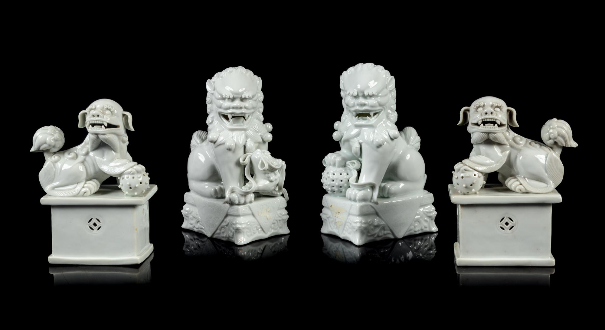 Two Pairs of Chinese Blanc-de-Chine Porcelain Figures of Fu Lions