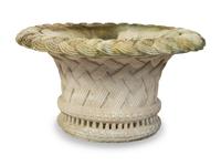 A Large Poured Cement Basket-Form Planter — 20TH CENTURY