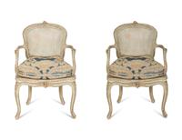 A Pair of Louis XV Blue Painted Cane-Backed Fauteuils
