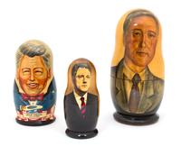 A Collection of Three Russian Bill Clinton Nesting Dolls Height of tallest 10 1/2 inches. — 20TH CENTURY
