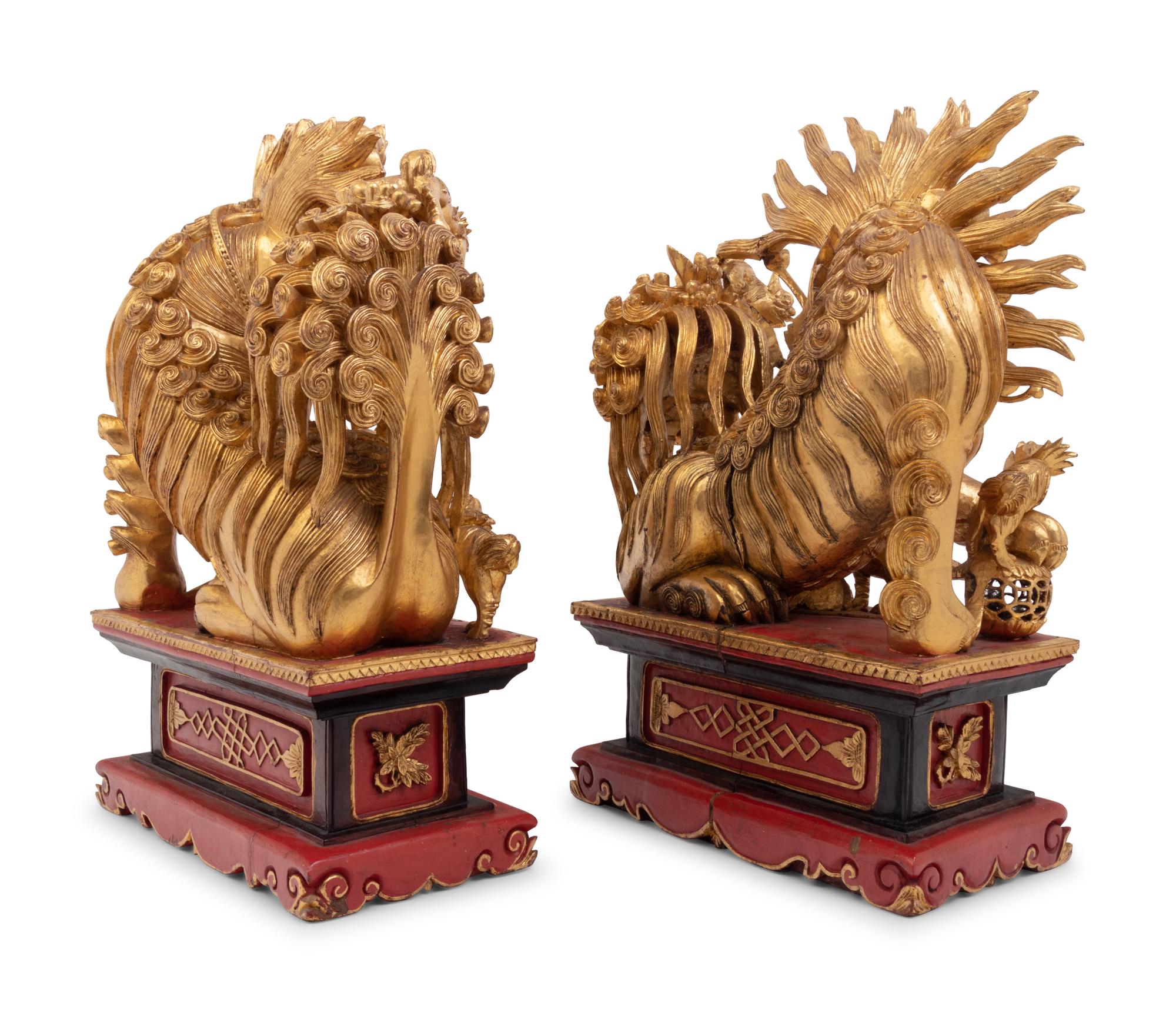 A Pair of Chinese Carved Giltwood Ornaments