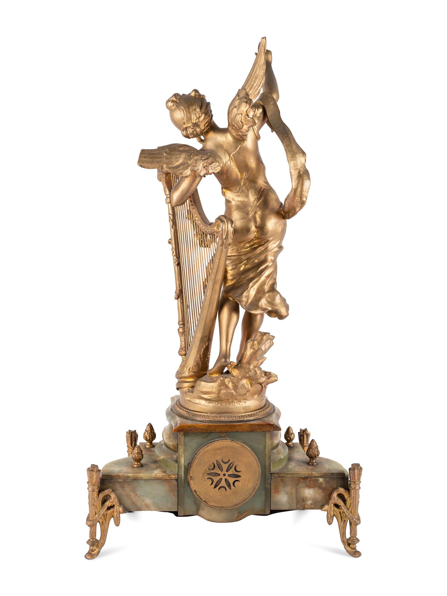 A Neoclassical Gilt Metal and Onyx Clock Garniture