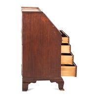 A Chippendale Carved and Paneled Mahogany Slant-Front Desk-and-Bookcase