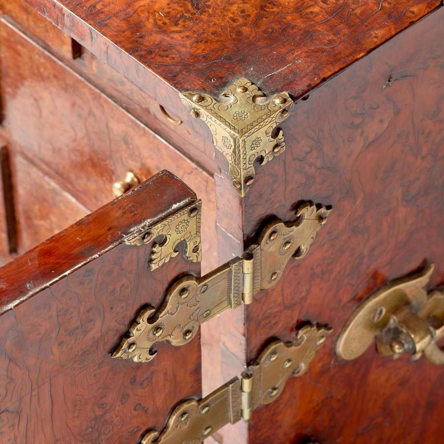 A Queen Anne brass-mounted burl yew table cabinet circa 1710
