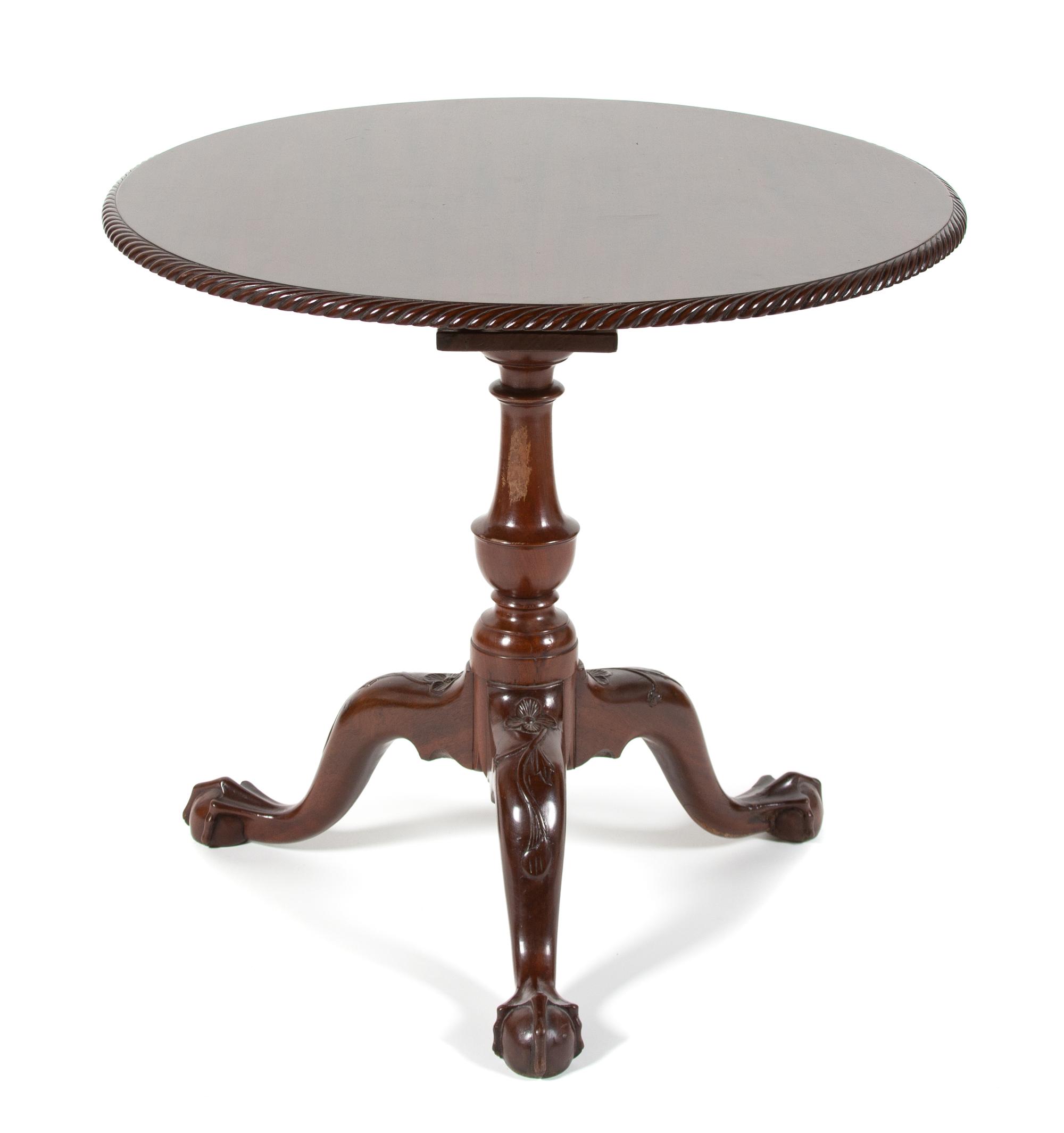 A George II Style Mahogany Tilt Top Table Height 27 1/2 x diameter 30 inches. — LATE 19TH CENTURY