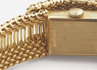 A Ladies 14K Yellow Gold Hidden Dial Watch