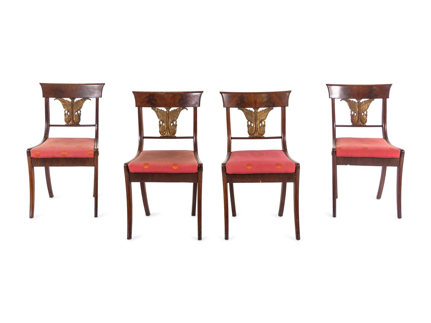 A Set of Four Italian Parcel Gilt Walnut Side Chairs