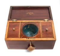 A George III Cross-Banded and Marquetry Mahogany Tea Caddy Height 6 x width 12 x depth 6 inches.