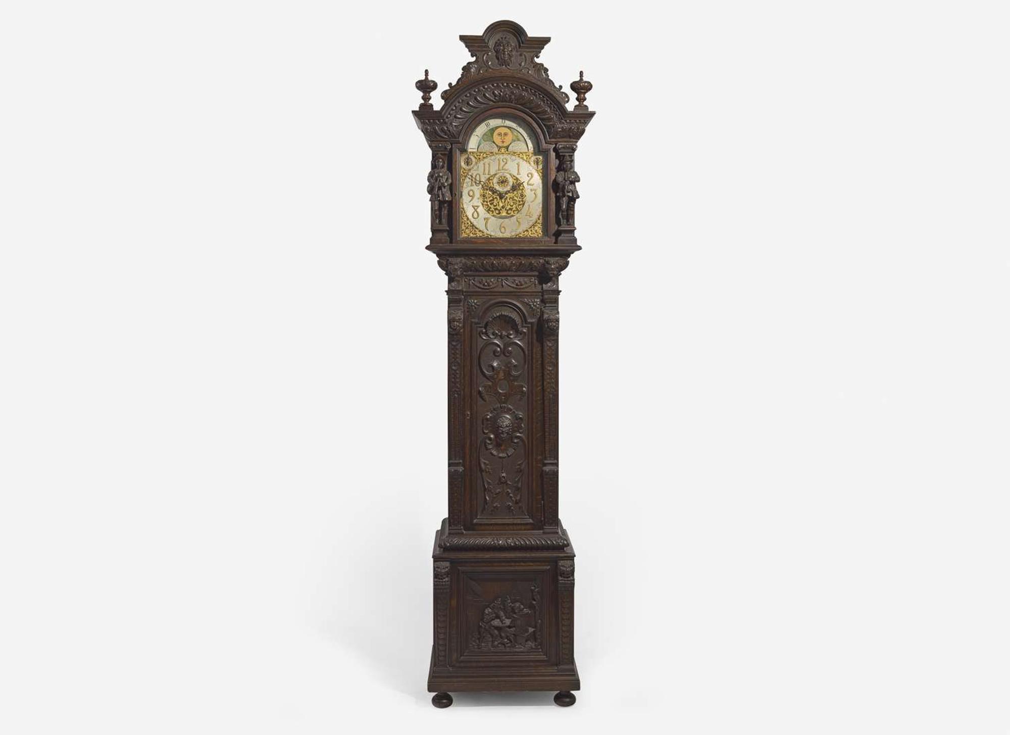 An impressive Renaissance Revival carved oak tall case clock, the case attributed to R.J. Horner & Co., New York, NY, with works by Winterhalder & Hofmeier, Schwaerzenbach, Black Forest, Germany, retailed by Tilden Thurber Co., Providence, RI, late 19th / early 20th century