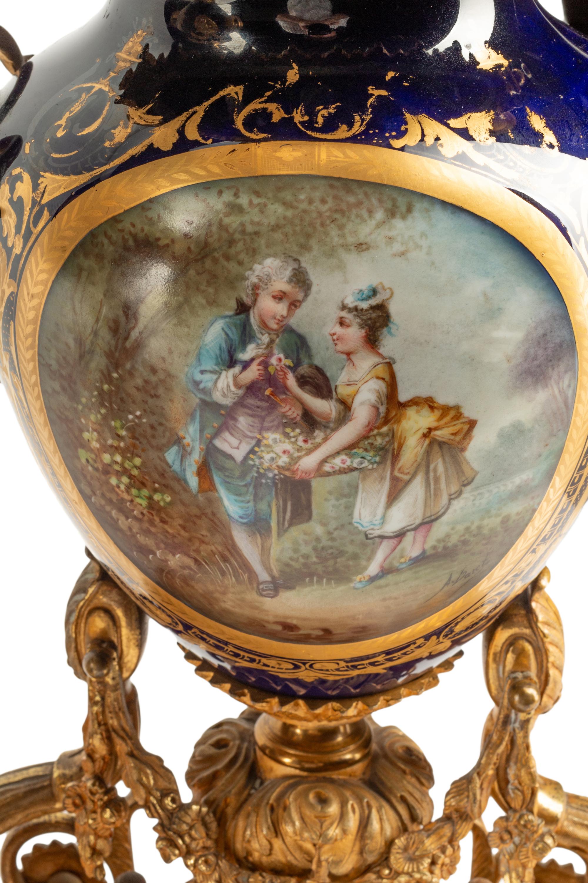 A French Gilt Bronze and Sèvres Style Porcelain Clock Garniture