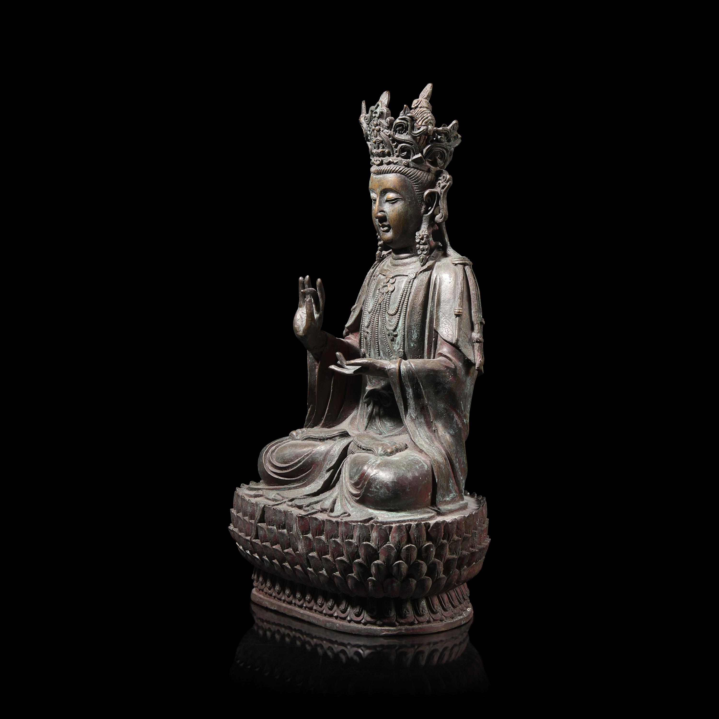A Chinese Patinated Bronze Figure of a Seated Bodhisattva 銅觀音坐像