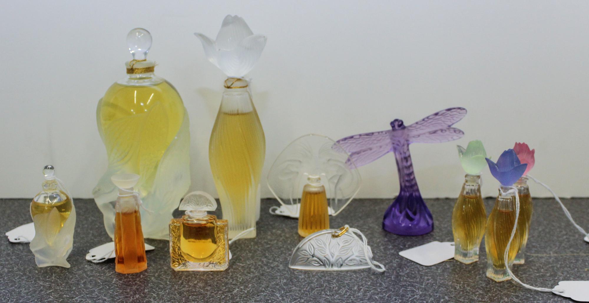A Collection of Eleven Lalique and Other Perfume Bottles. Height of tallest 5 3/4 inches.