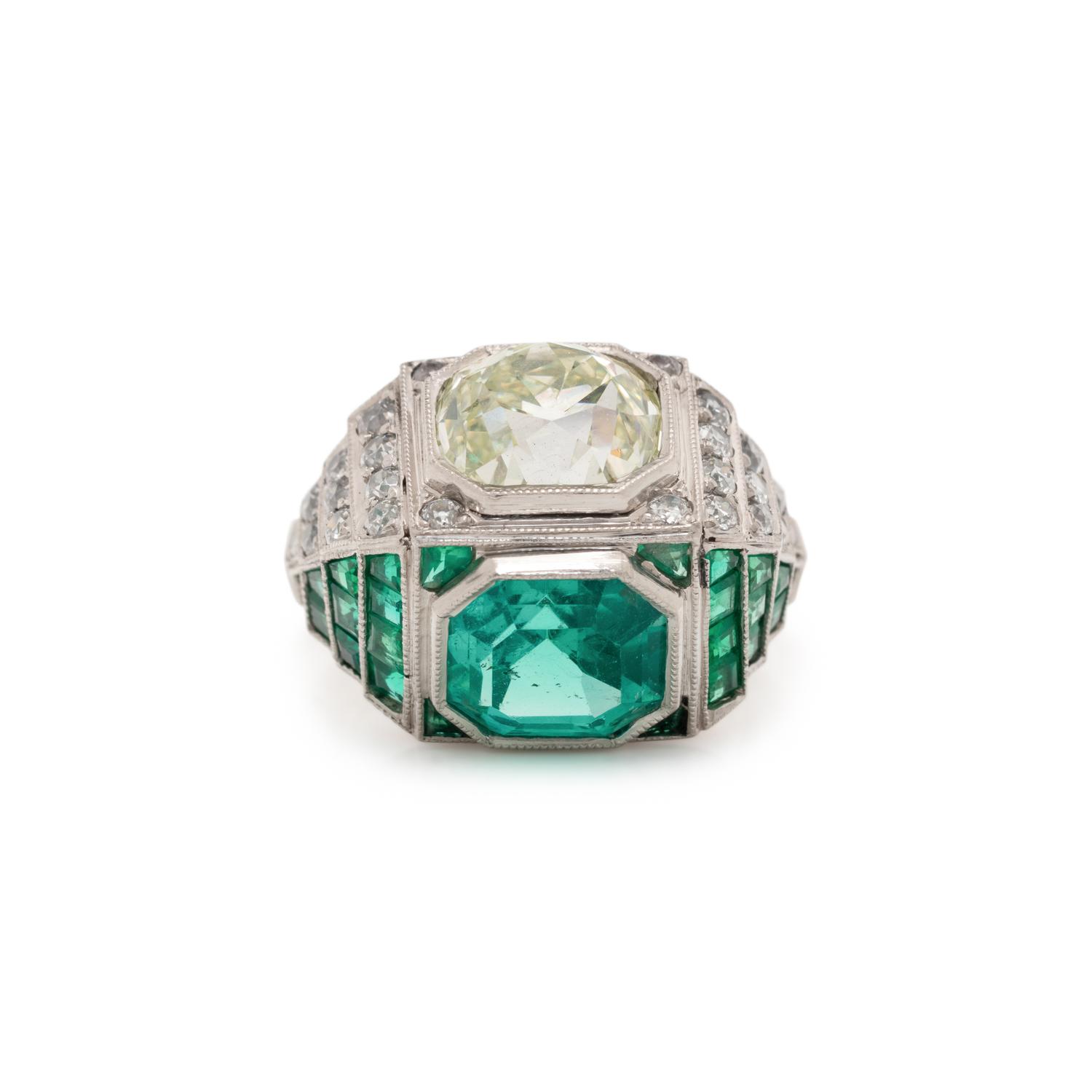 ART DECO, EMERALD AND DIAMOND SCULPTURAL 'TOI ET MOI' RING