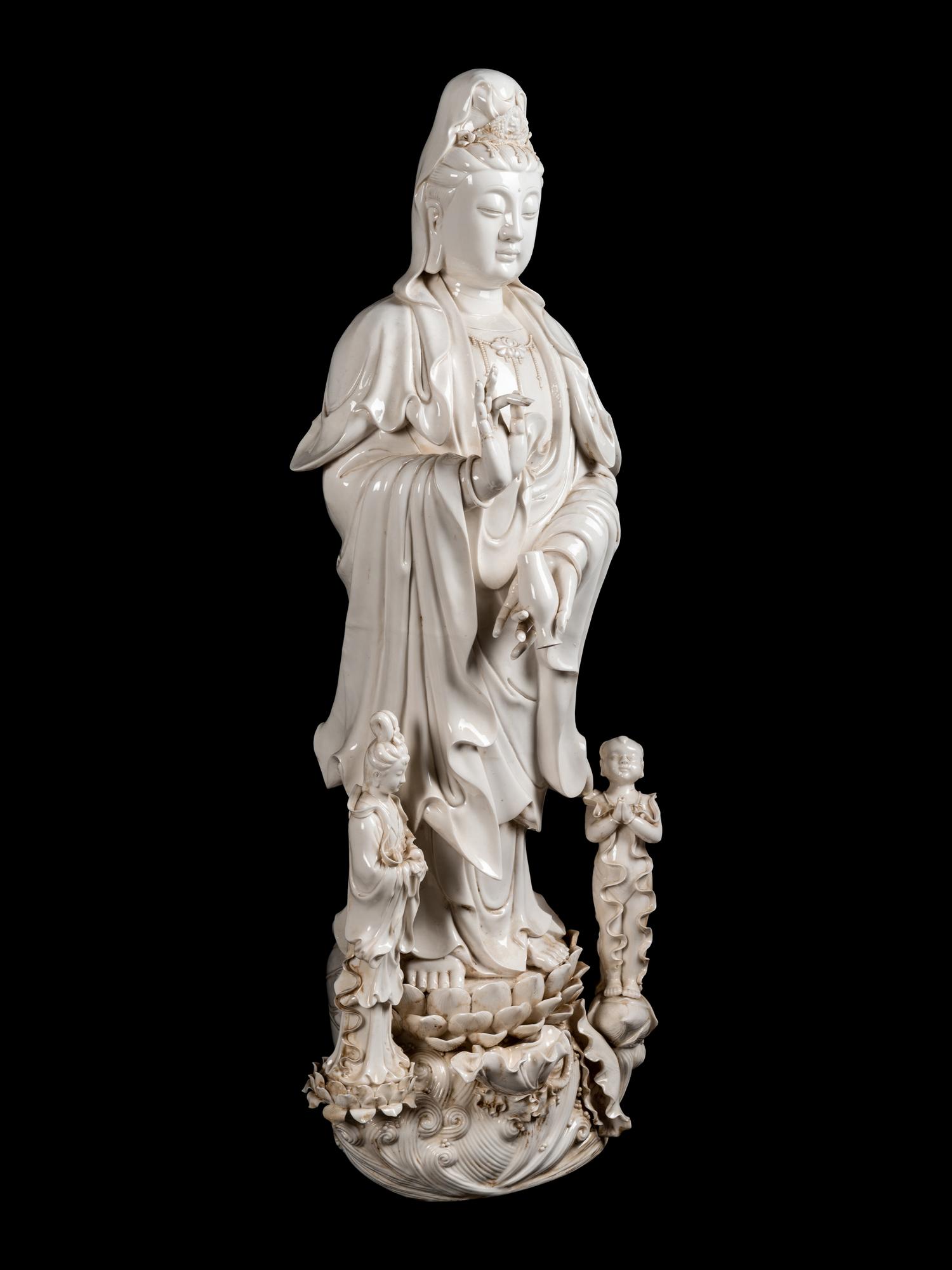 A Monumental Chinese Blanc-de-Chine Porcelain Guanyin Figural Group