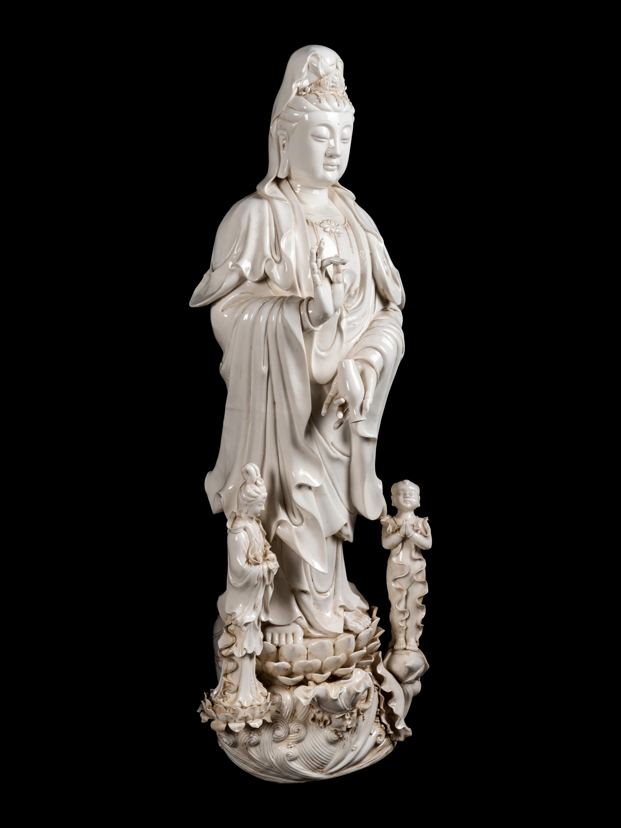 A Monumental Chinese Blanc-de-Chine Porcelain Guanyin Figural Group