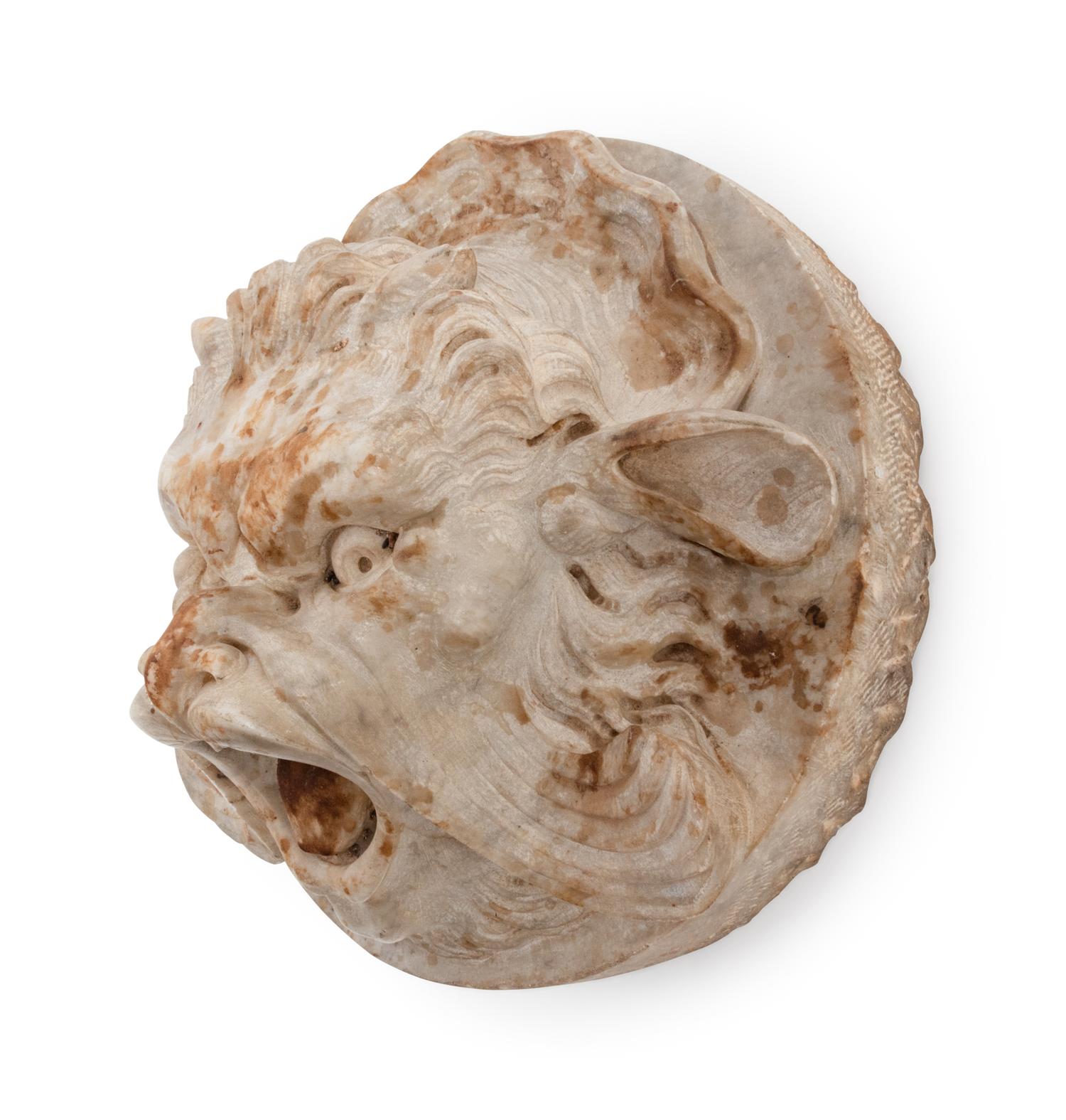 A Continental Carved Stone Grotesque Mask