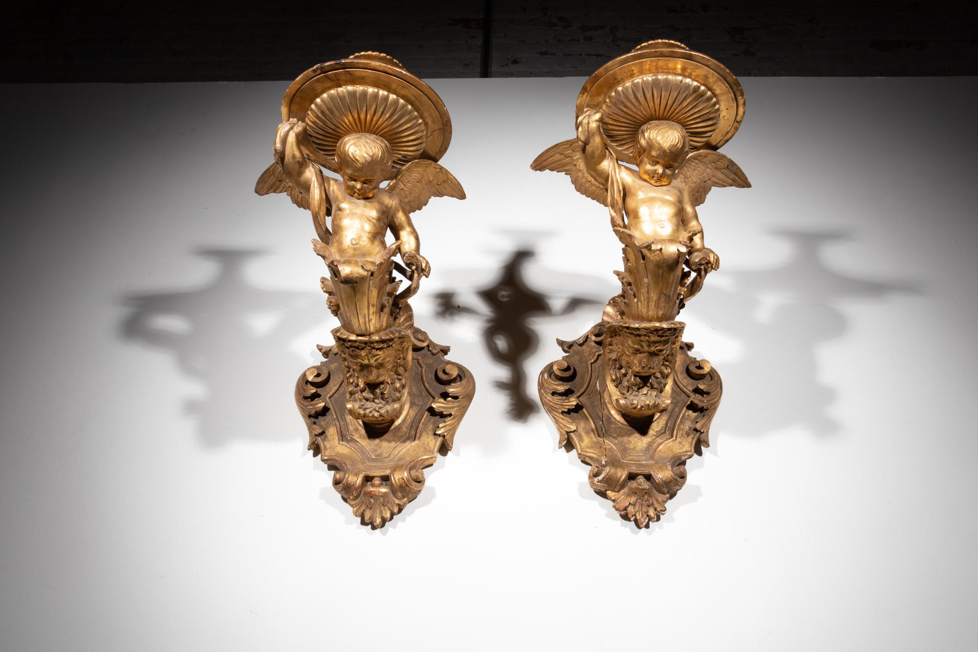 A Pair of Italian Giltwood Figural Wall Brackets