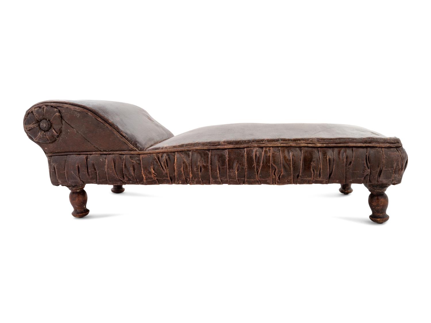 A Victorian Diminutive Leather Upholstered Chaise Longue