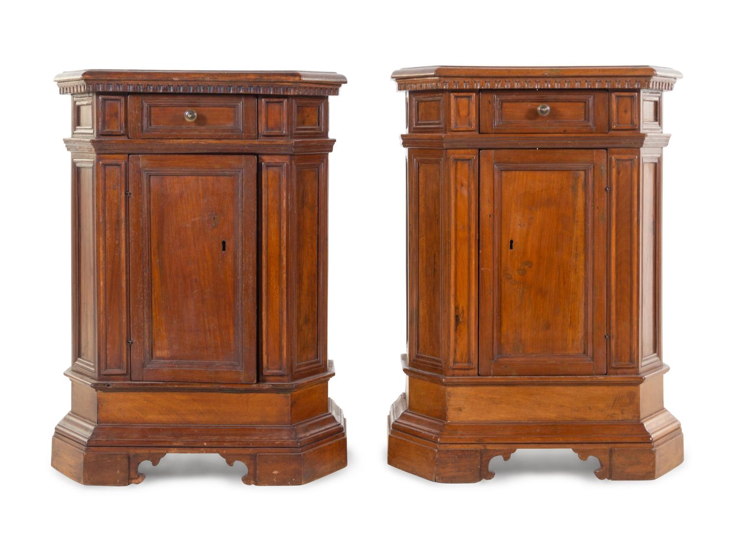 A Pair of North Italian Carved and Paneled Walnut Cabinets
