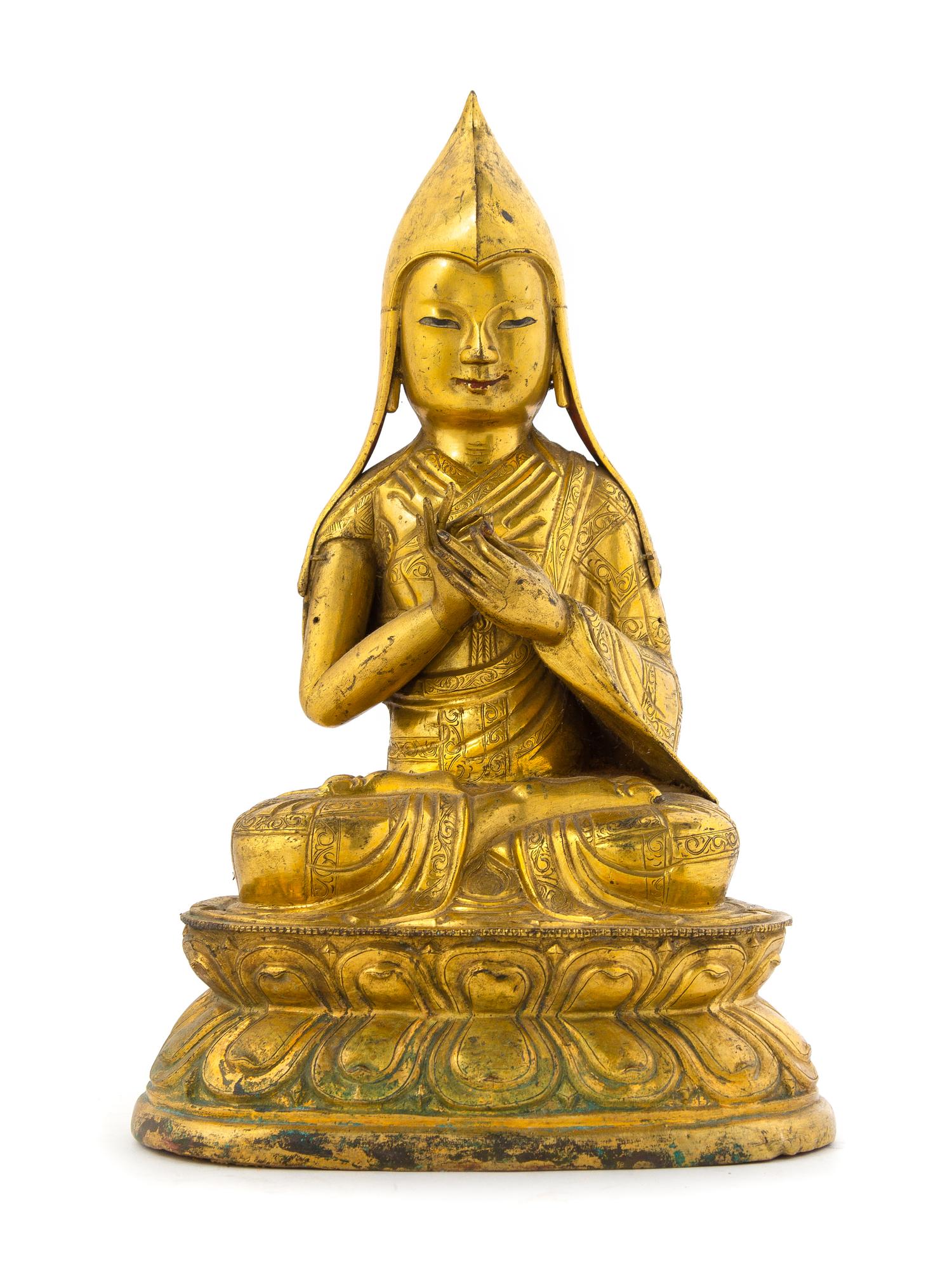 A Sino-Tibetan Gilt Copper Repousse Figure of Tsongkapa Height 12 1/2 inches. — 18TH/19TH CENTURY