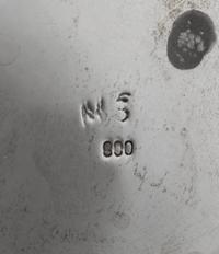 A German Silver Center Bowl, Maker's Mark Obscured, Late 19th/Early 20th Century, the body centered with C-scrolls enclosing a vacant c