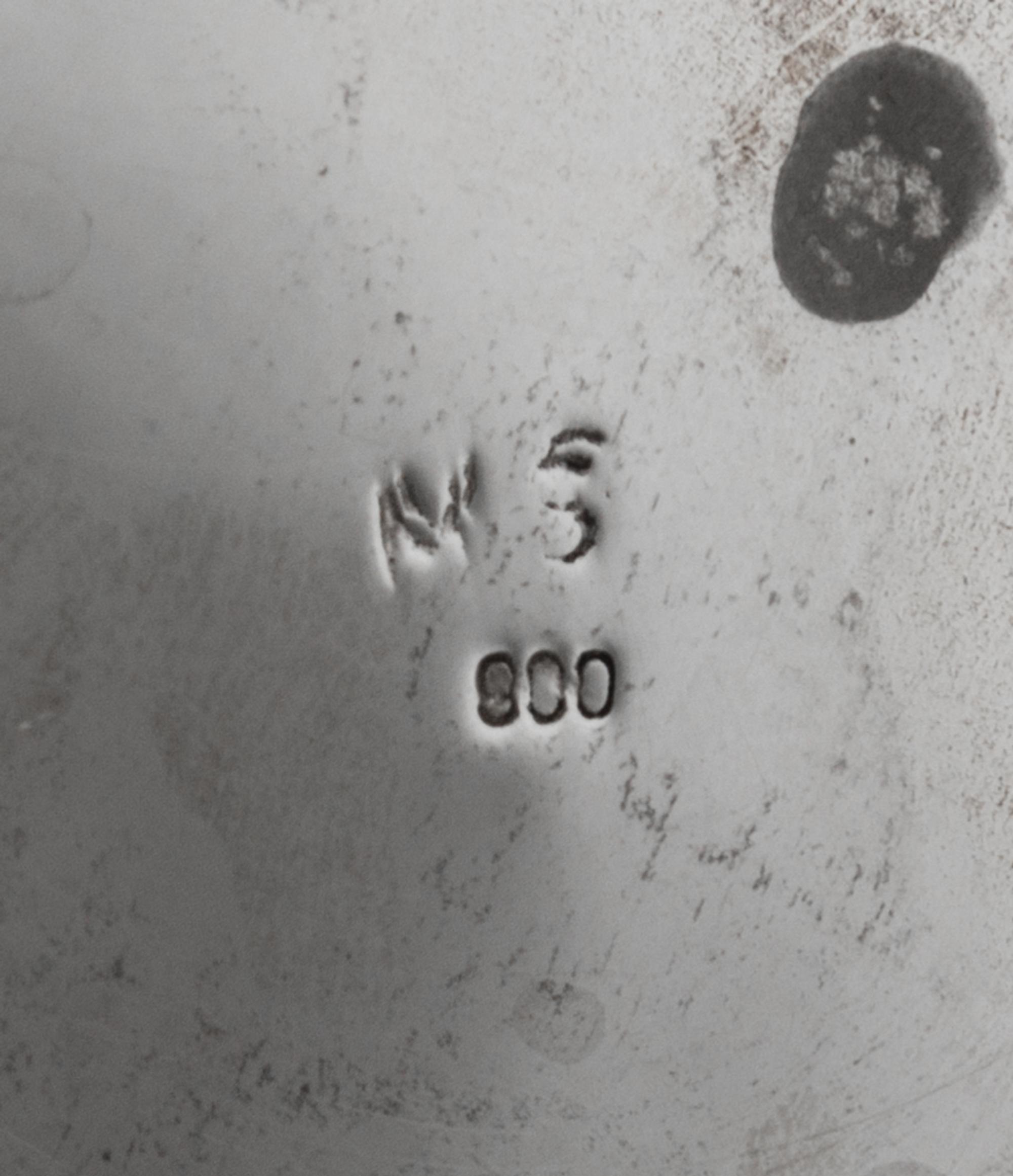 A German Silver Center Bowl, Maker's Mark Obscured, Late 19th/Early 20th Century, the body centered with C-scrolls enclosing a vacant c