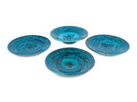 A Set of Four Persian Turquoise Glazed Earthenware Plates