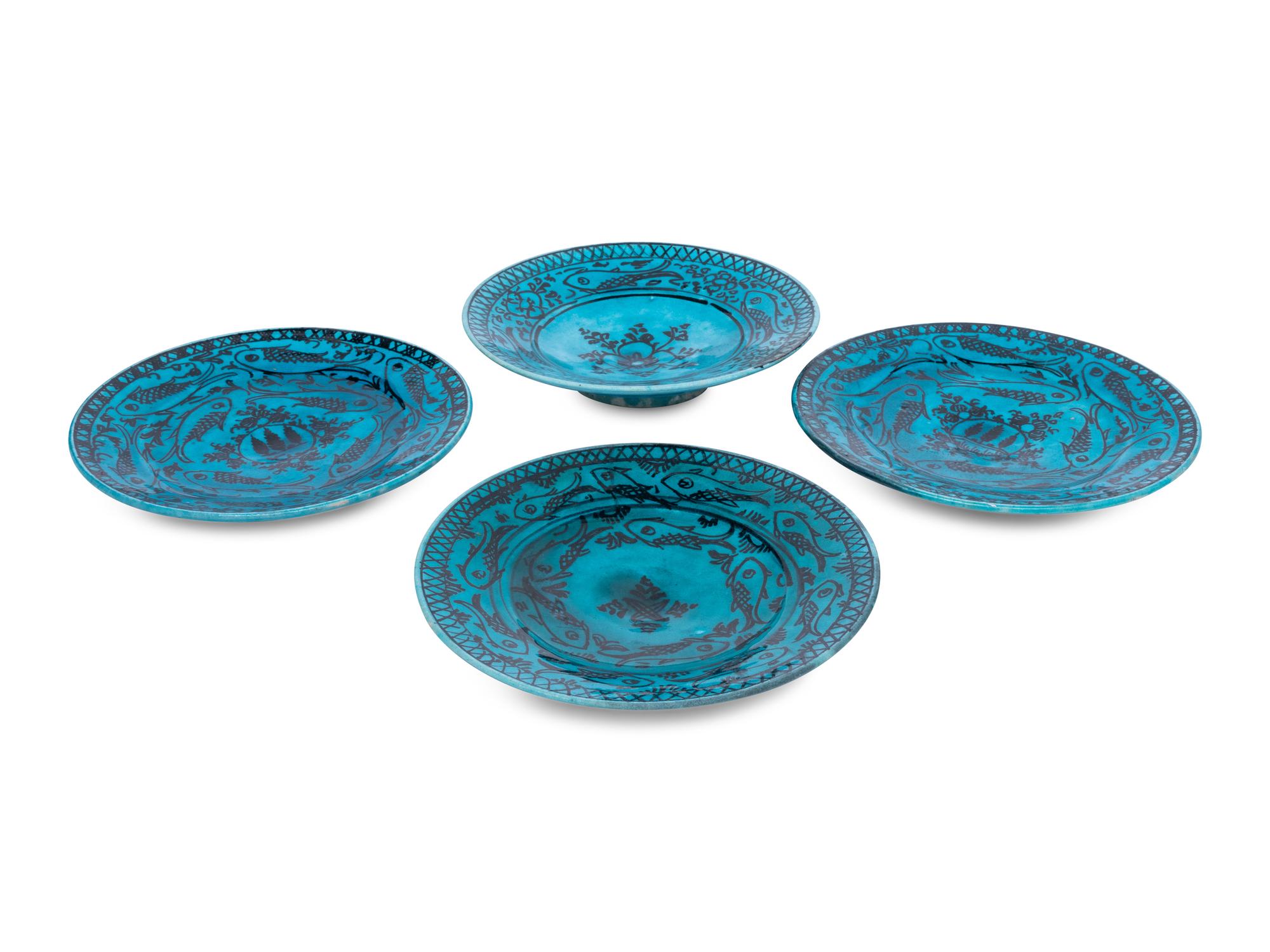 A Set of Four Persian Turquoise Glazed Earthenware Plates