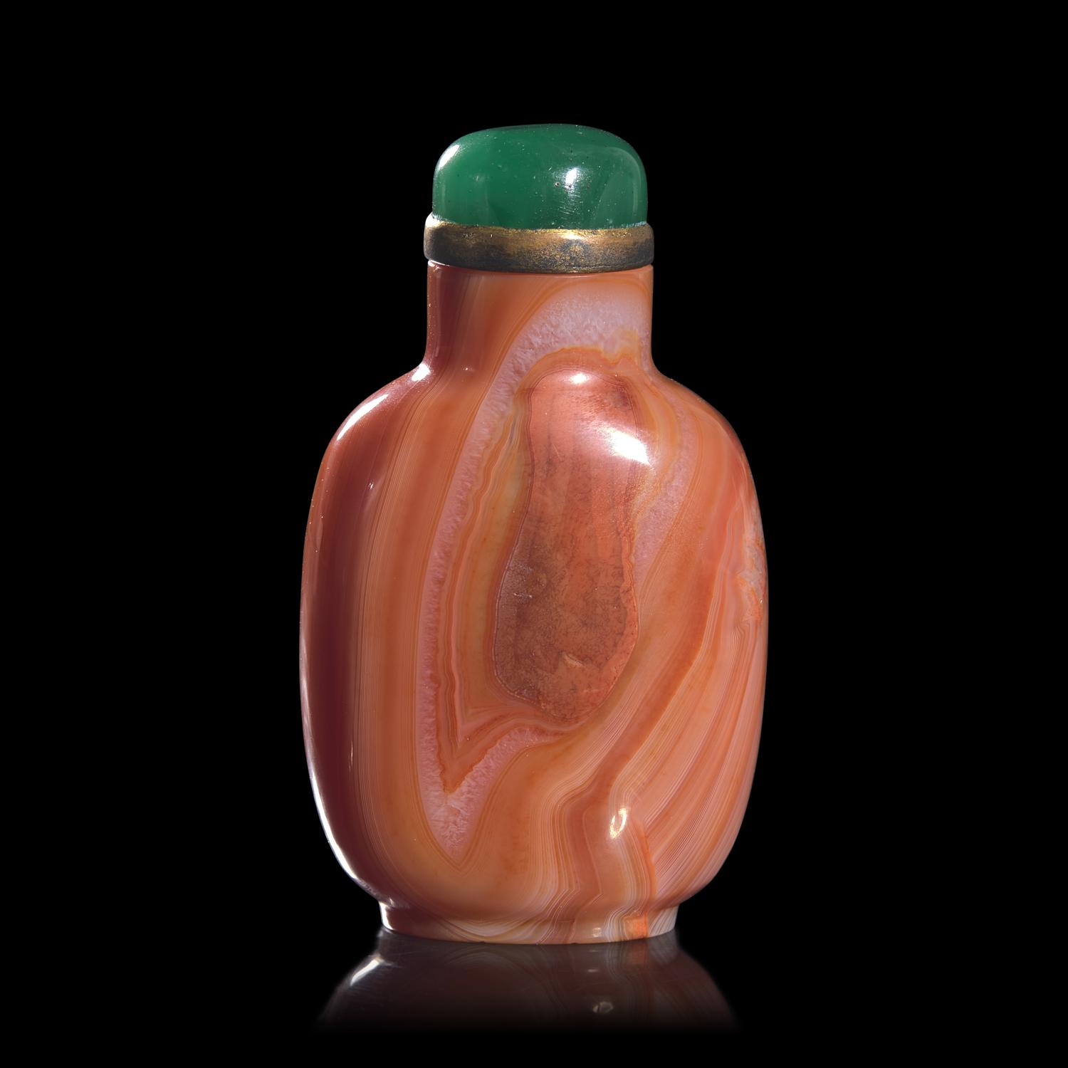 A Chinese Carved Coral-Red "Thumbprint" Agate Snuff Bottle