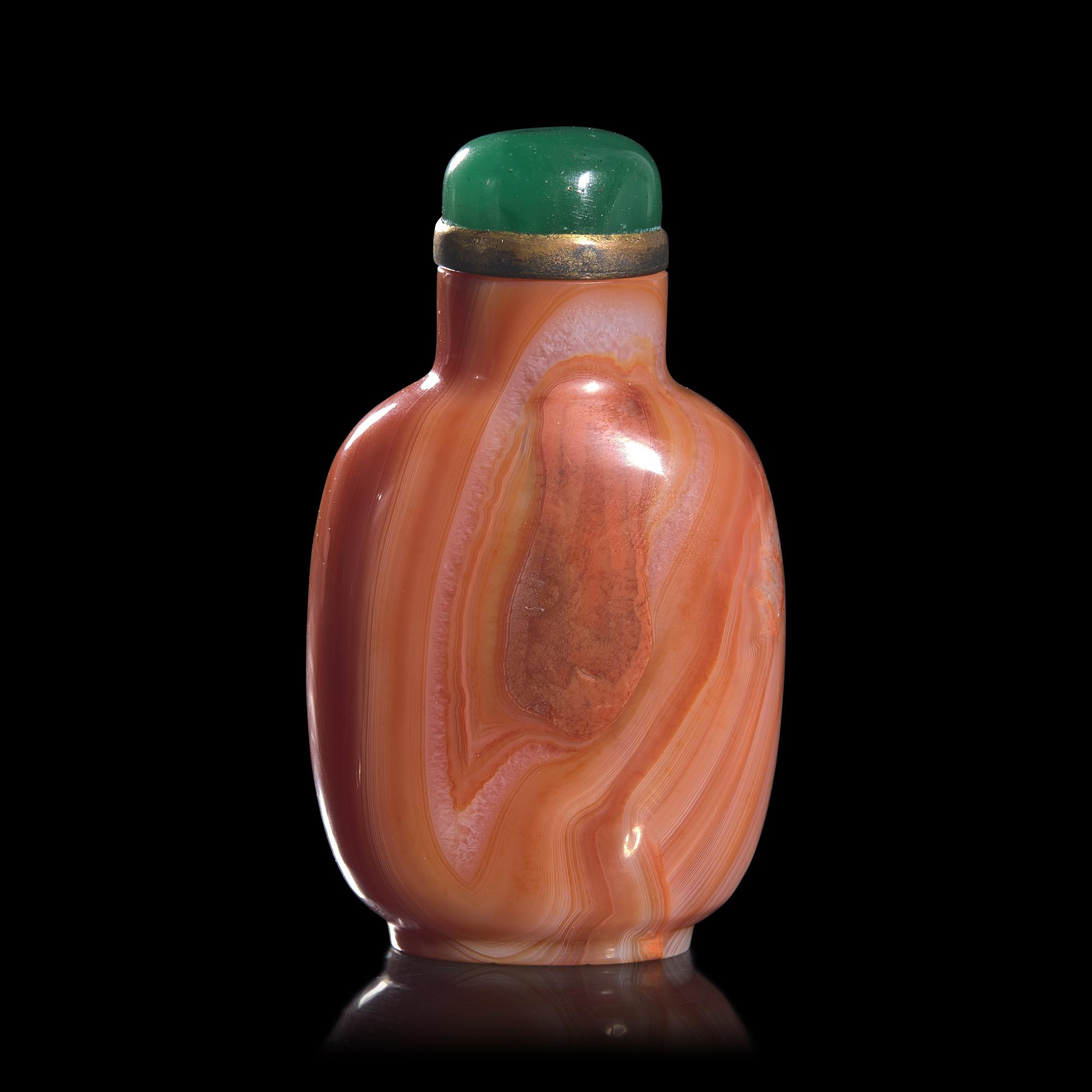A Chinese Carved Coral-Red "Thumbprint" Agate Snuff Bottle