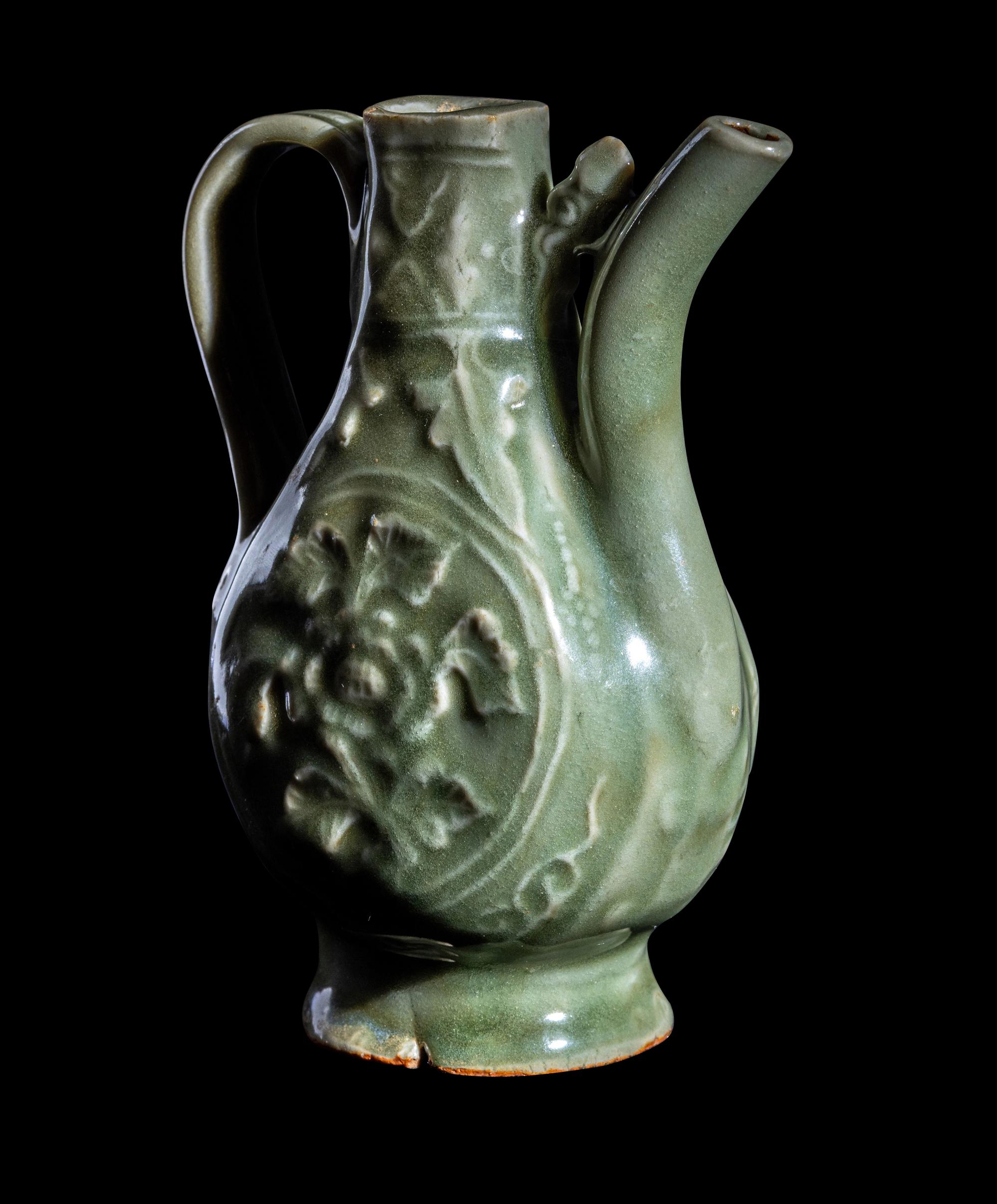 A Chinese Carved Longquan Celadon Glazed Porcelain Ewer