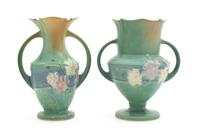 A Near Pair of Roseville Cosmos Pottery Vases Height of each 8 3/8 inches.