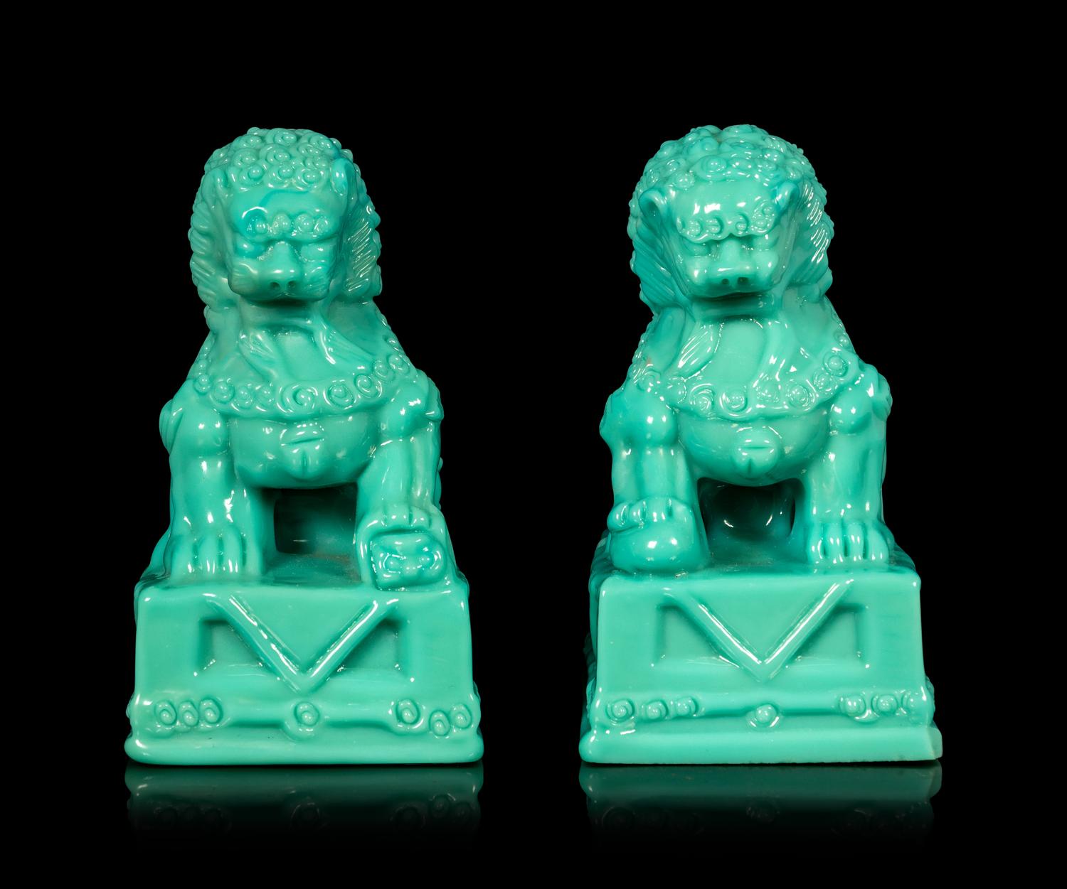 A Pair of Chinese Molded Glass Figures of Fu Lions