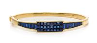 A Yellow Gold and Sapphire Bangle Bracelet, Kurt Wayne, 22.30 dwts.