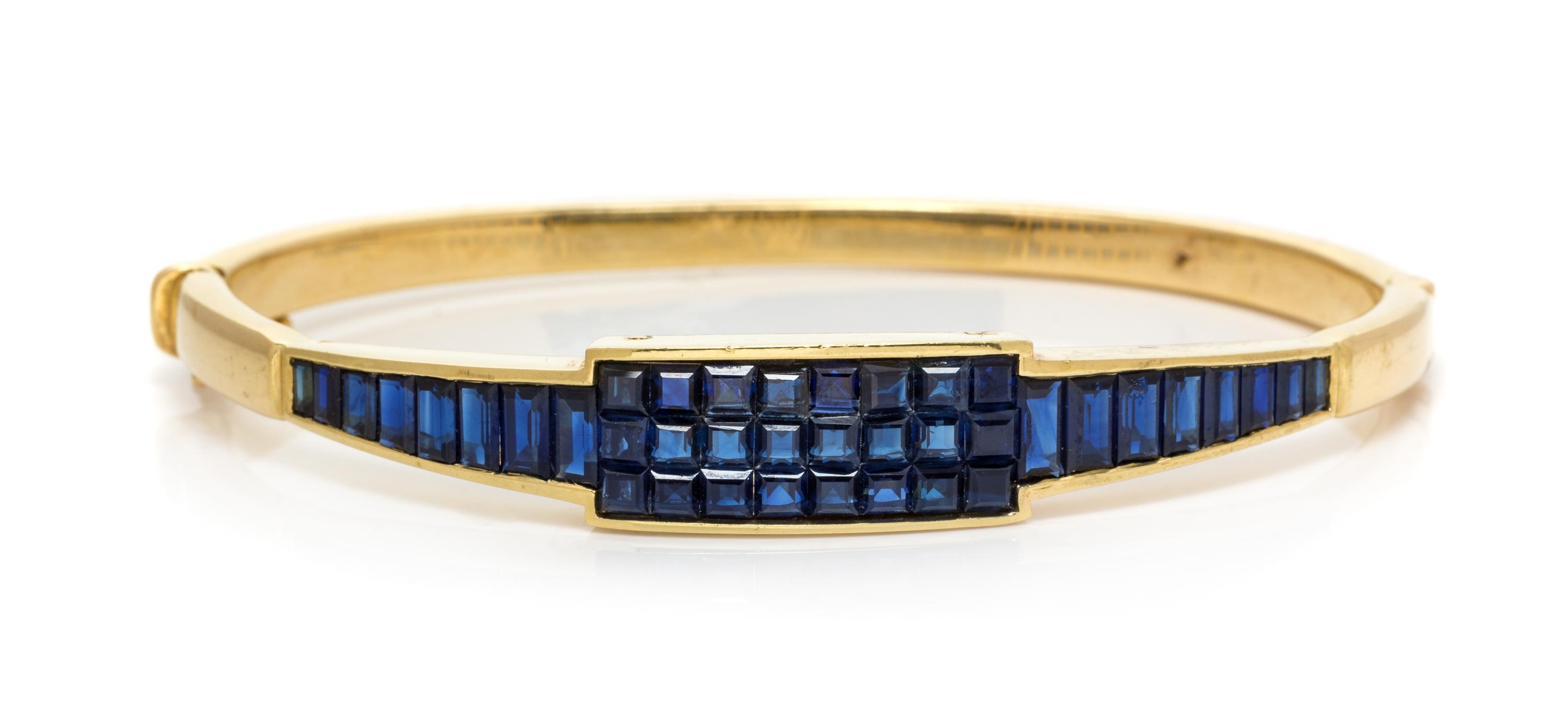 A Yellow Gold and Sapphire Bangle Bracelet, Kurt Wayne, 22.30 dwts.