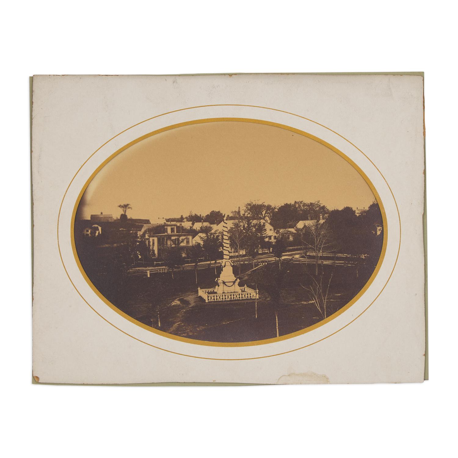 [Lincoln, Abraham]. A group of 3 photographs showing buildings and monuments draped in mourning.