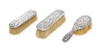Three American Silver Brushes, Various Makers, comprising a Tiffany & Co. Repousse hairbrush, together with a similarly decorated Gorha