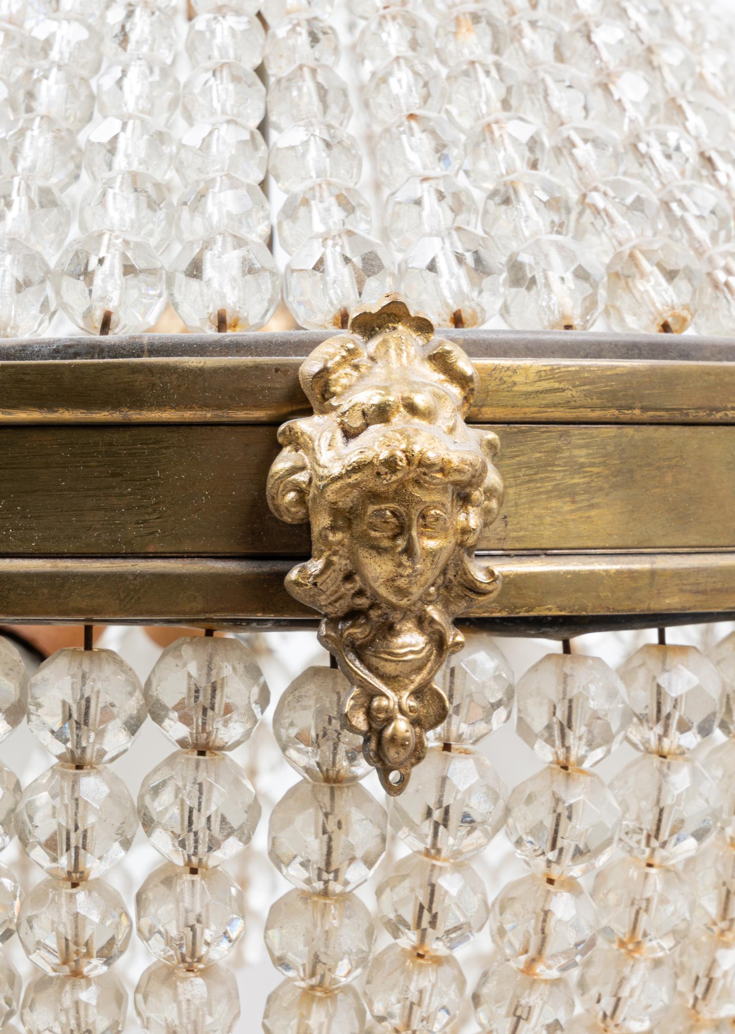 An Empire Style Gilt Metal and Beaded Glass Chandelier