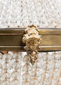 An Empire Style Gilt Metal and Beaded Glass Chandelier