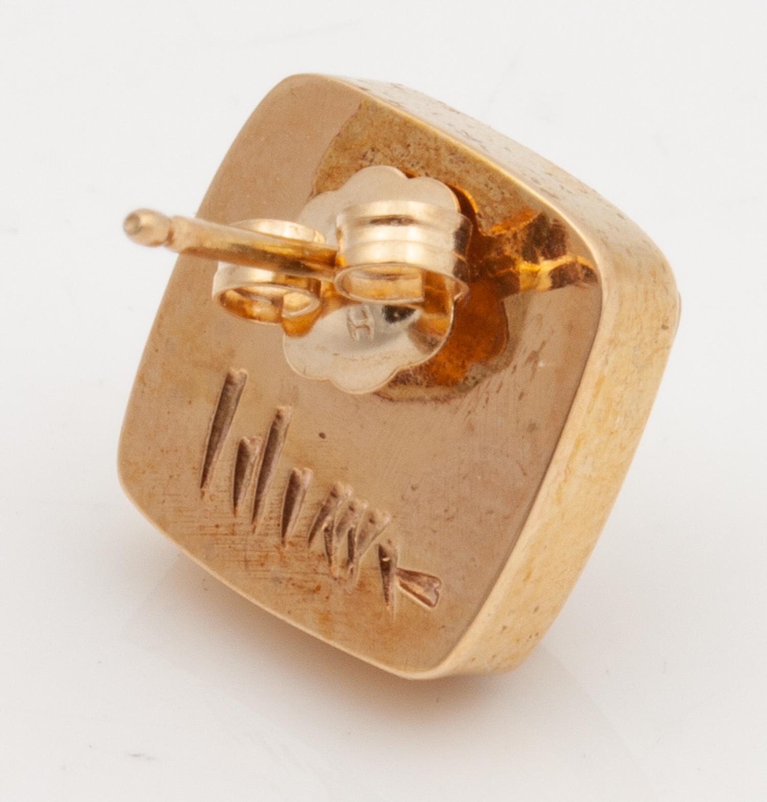 Gold And Fossilized Walrus Earrings Lot is located and will ship from Denver, Colorado.