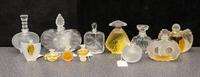 A Group of Twelve Lalique Glass Perfume Bottles Height of tallest 4 3/4 inches.