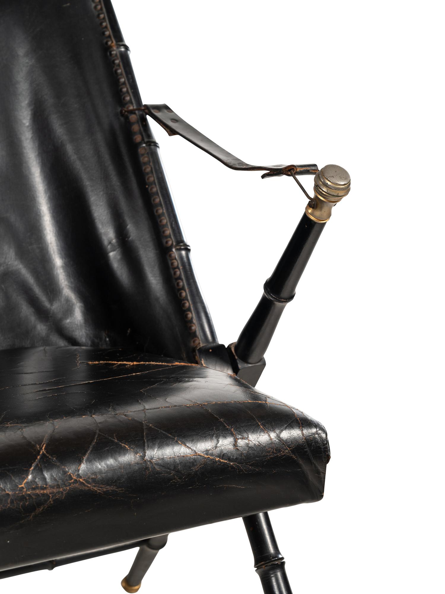 A Pair of Spanish Leather-Upholstered Campaign Folding Chairs by Valenti