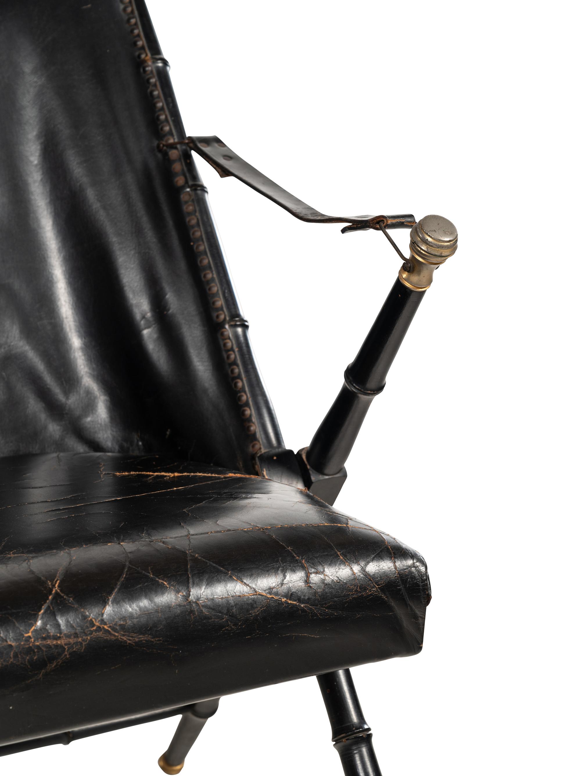 A Pair of Spanish Leather-Upholstered Campaign Folding Chairs by Valenti
