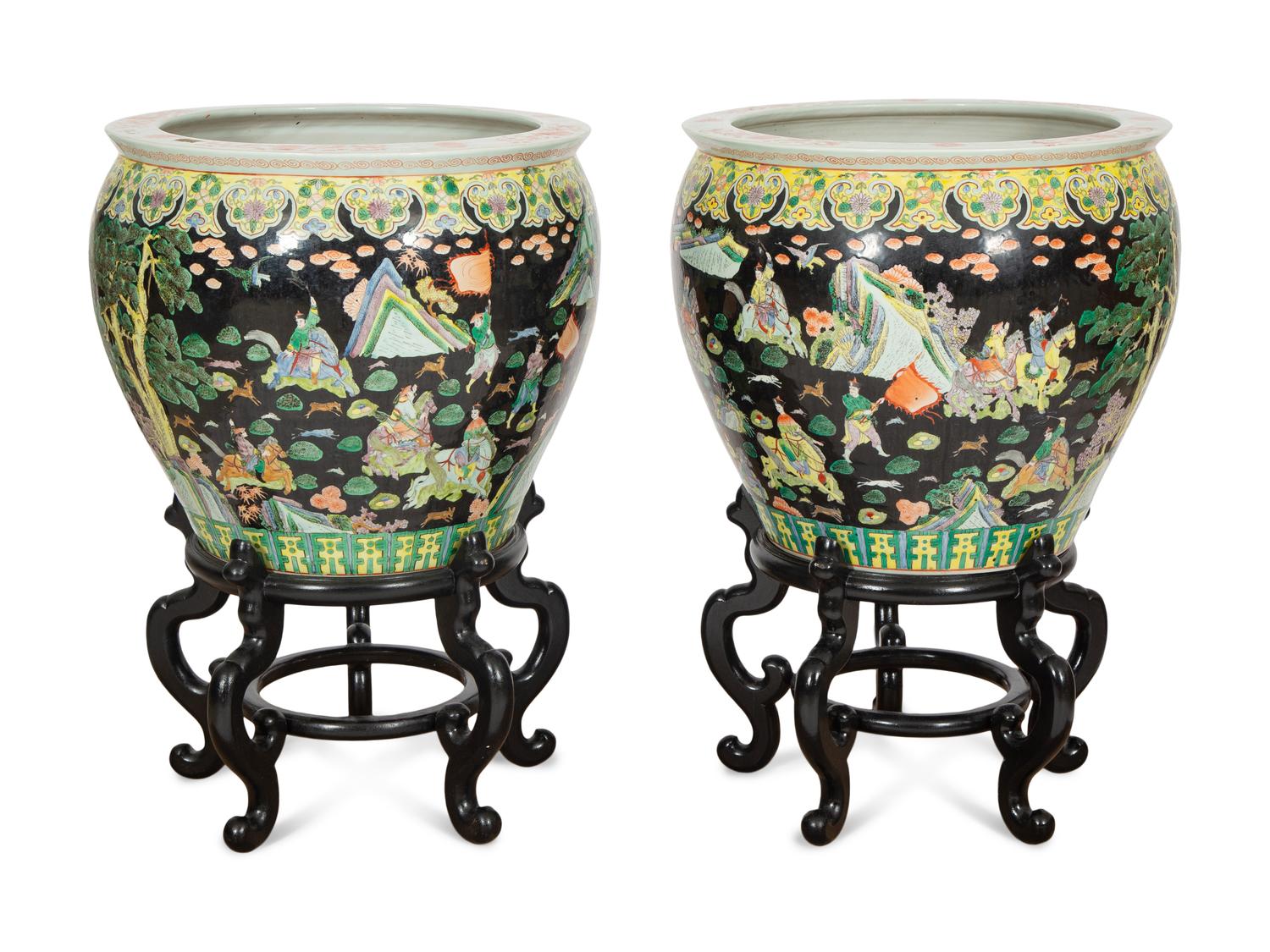 A Pair of Large Famille Noir Porcelain Fish Bowls on Teak Stands