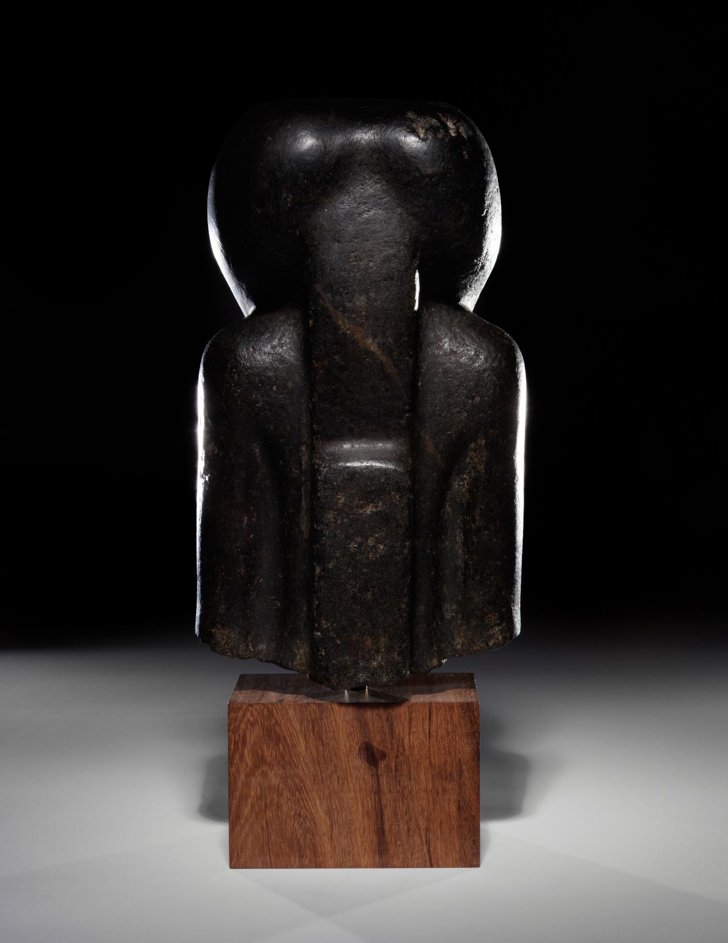 An Egyptian Basalt Portrait Bust of a Woman