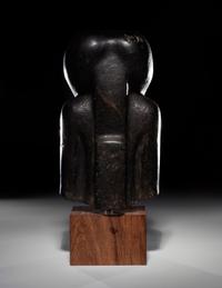 An Egyptian Basalt Portrait Bust of a Woman