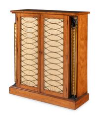 A Regency Satinwood, Part Ebonized and Parcel Gilt Cabinet